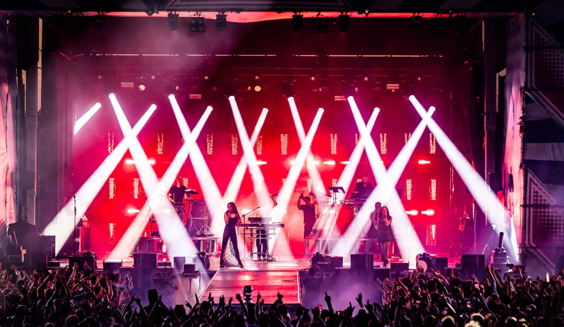 Chauvet beam lighting over a live concert crowd